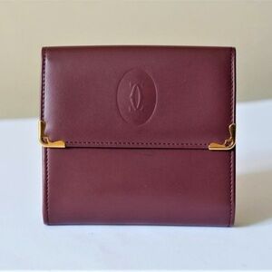 𝓒𝓐𝓡𝓣𝓘𝓔𝓡 Must de Cartier bifold wallet in burgundy (Bordeaux) leather